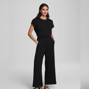 SPANX Black short sleeve cinched waist Jumpsuit